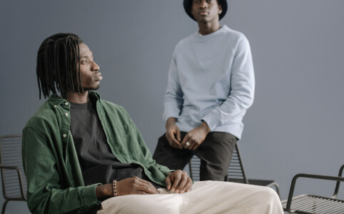 Two men chilling in a room
